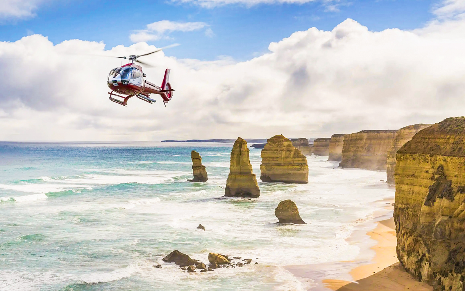 Aerial view of the Great Ocean Road coastline during a helicopter tour in Australia.