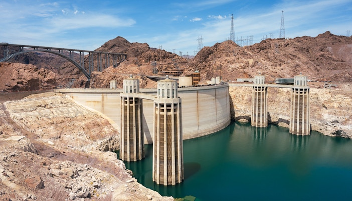 Visitors exploring Hoover Dam with panoramic views of the Colorado River, Las Vegas Hoover Dam Exploration Tour.