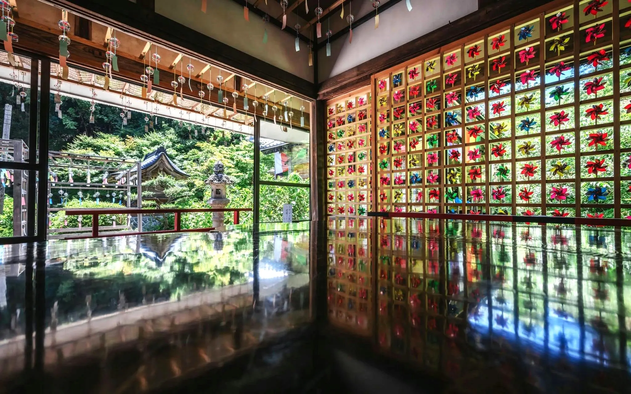 Wind chimes and colorful art installation at Kyoto Summer Limited Wind Chime Festival.