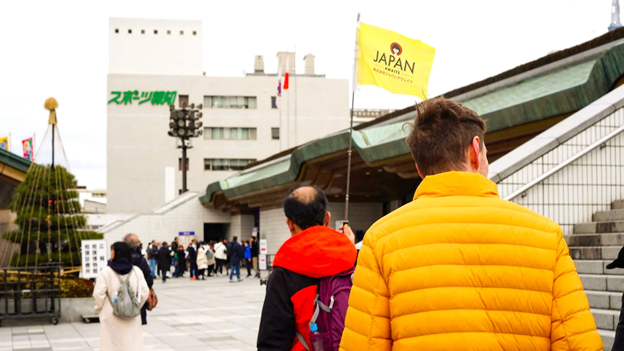 Visitors entering Ryogoku Kokugikan for Tokyo Sumo Tournament guided tour.