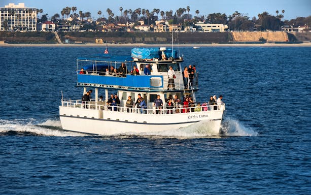 Sightseeing cruise boat with passengers in Los Angeles Harbor.