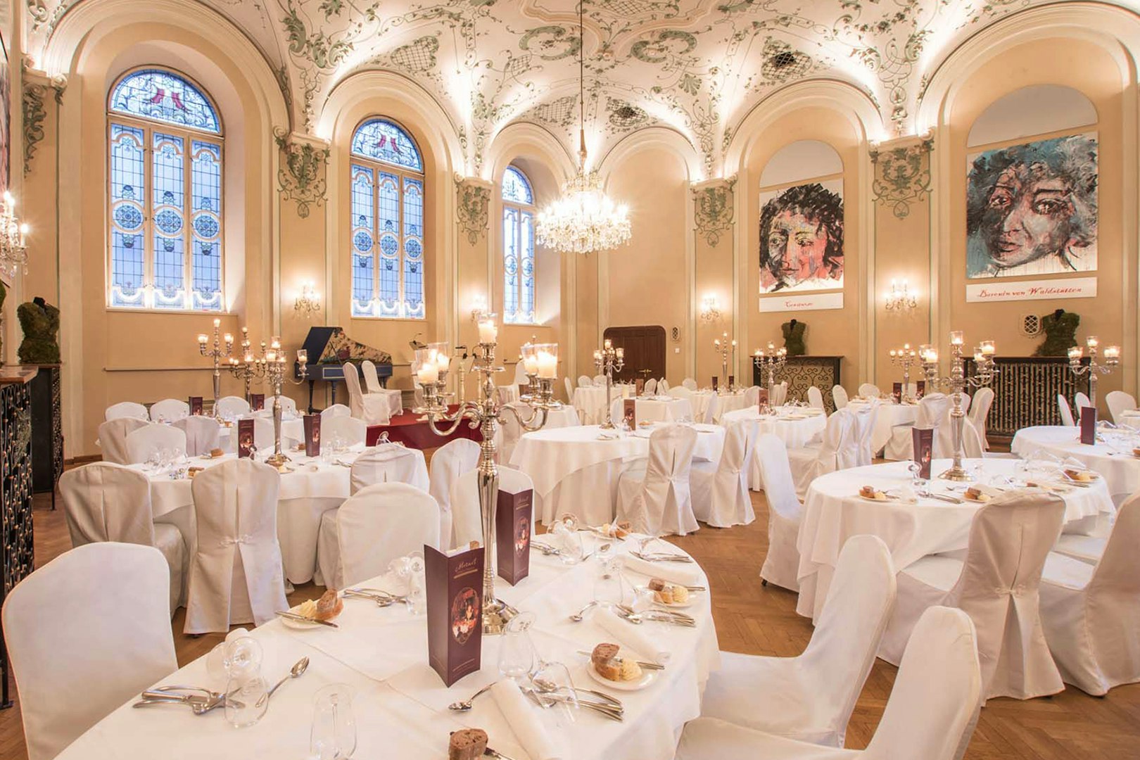 Elegant dining hall in Salzburg set for a Mozart concert with three-course dinner.
