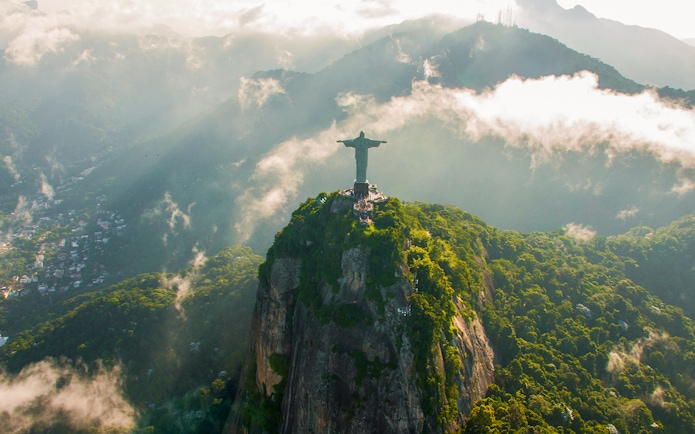Aerial view of Christ the Redeemer in Rio de Janeiro during helicopter tour.