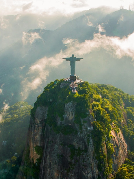 Aerial view of Christ the Redeemer in Rio de Janeiro during helicopter tour.