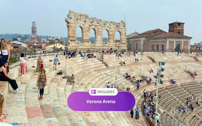Verona Arena arches with visitors seated on ancient stone steps.