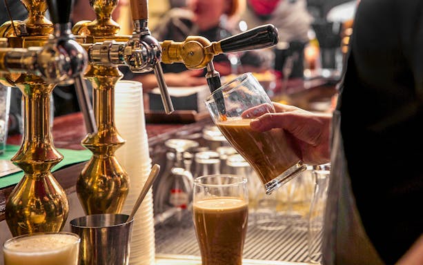 New Year celebration at Old Irish Pub in Spain with tap beer and festive decor.