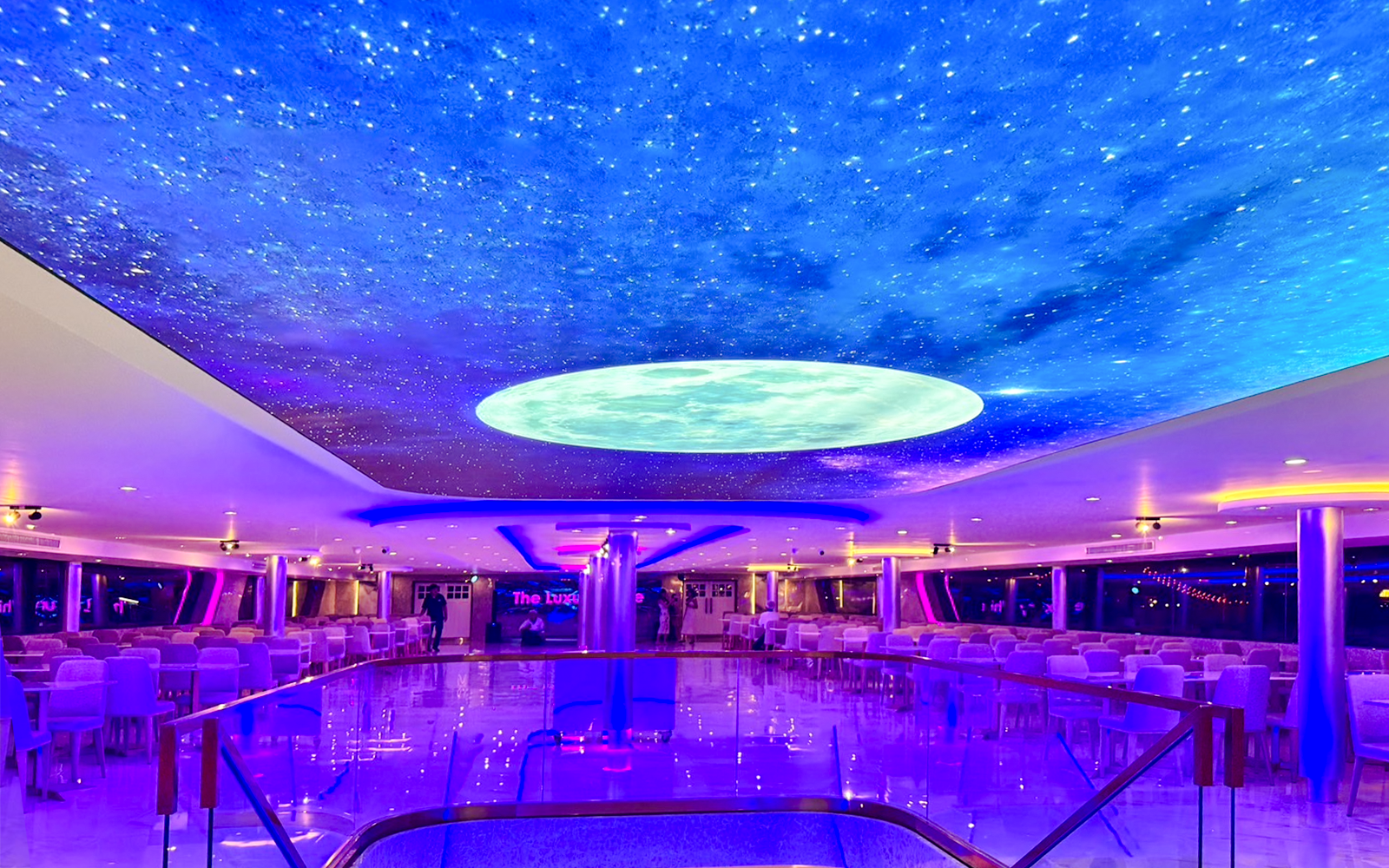 Luxury White Cruise ship interior with elegant dining area and panoramic windows, offering a premium travel experience.