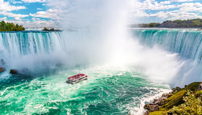 Niagara Falls Horseshoe Falls with tourist boat in foreground, Canada-USA full-day tour.