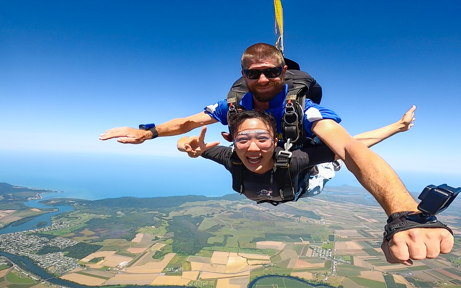Tandem skydive over Cairns with ocean and landscape views.
