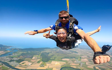 Tandem skydive over Cairns with ocean and landscape views.