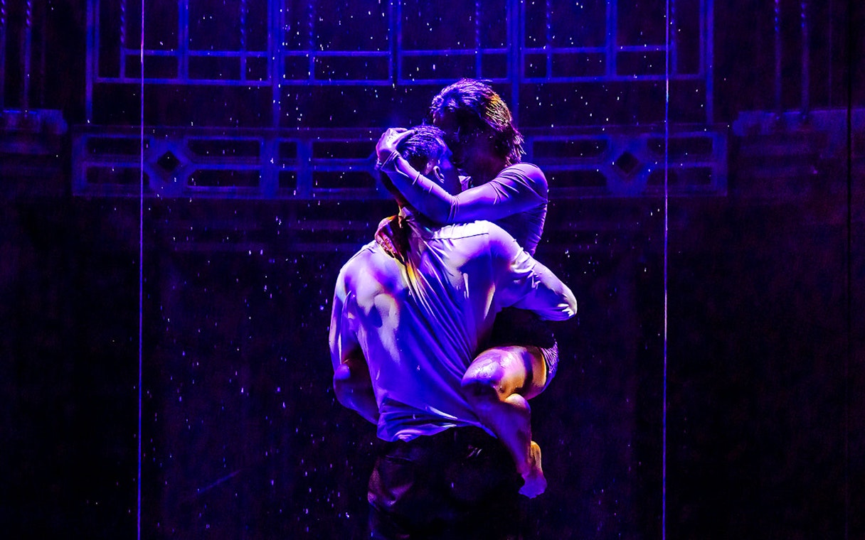 Performers in an embrace during Magic Mike Live show.