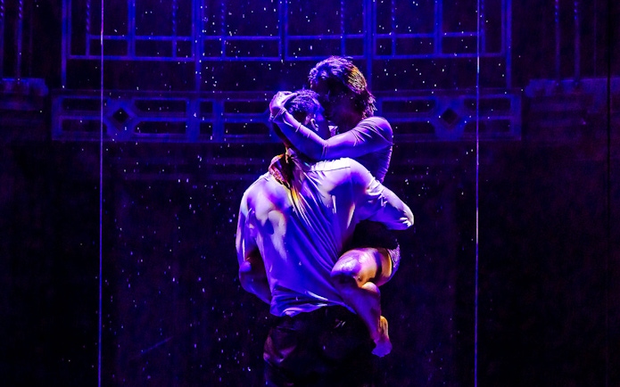 Performers in an embrace during Magic Mike Live show.