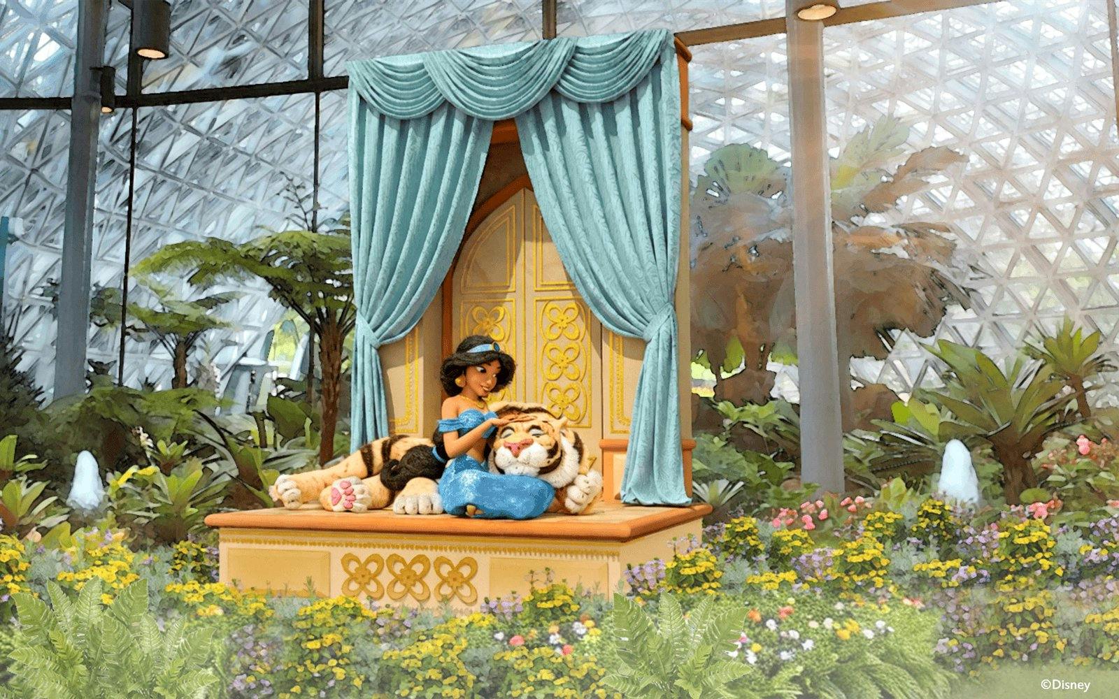 Jasmine with Rajah in a garden setting at a themed attraction.