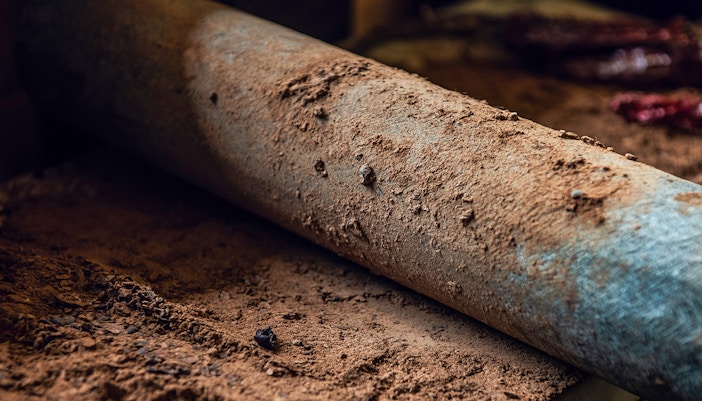 Chocolate grinder at a traditional chocolate-making workshop in Belgium.
