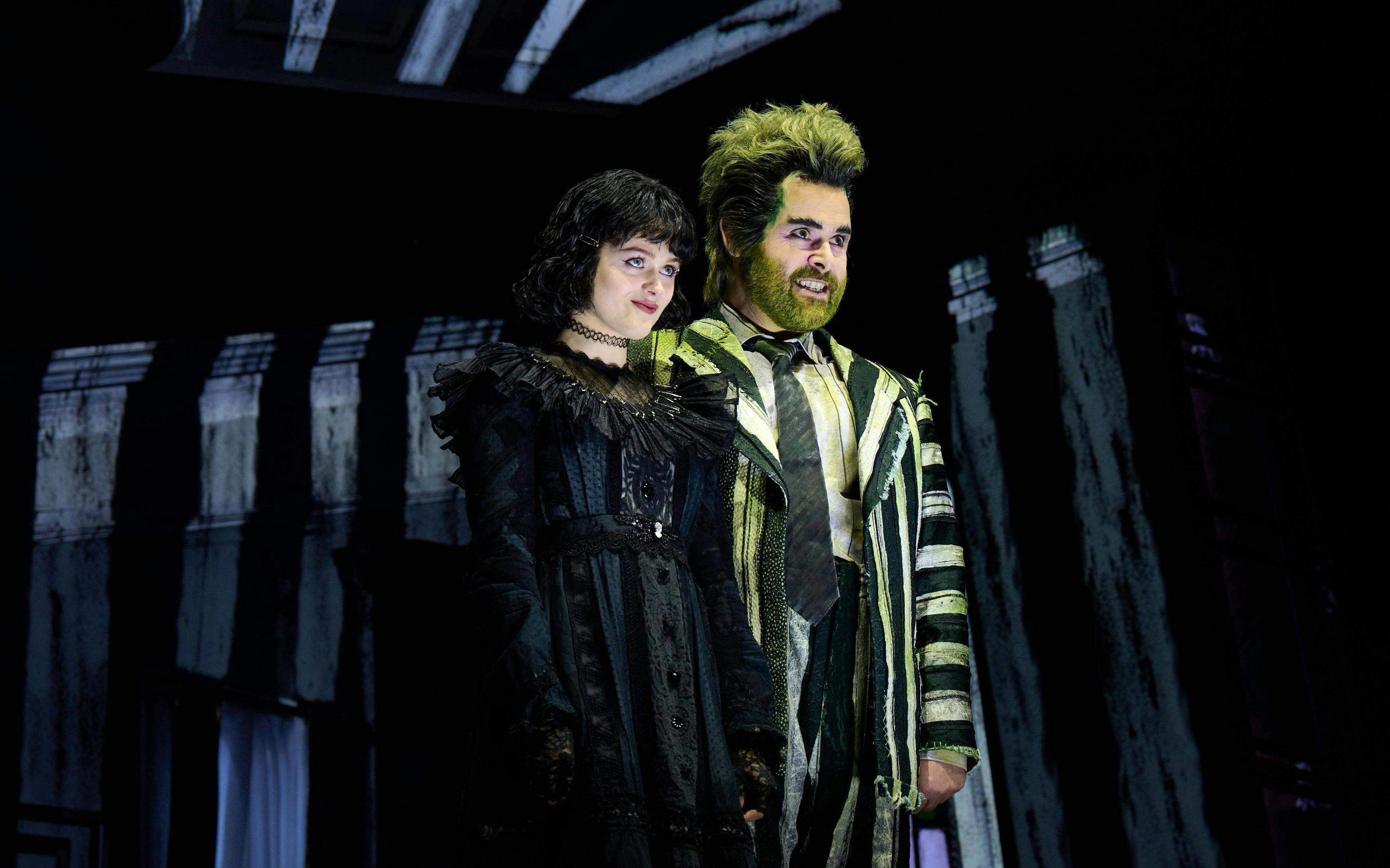 Beetlejuice stage performance at West End with two actors in costume.