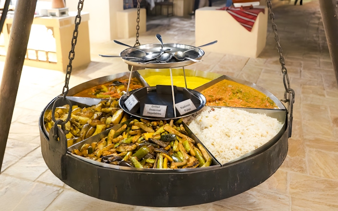 Grilled vegetables and rice dishes at a Royal Dinner Buffet in Dubai.
