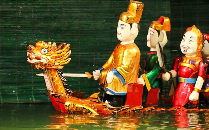 Royal puppet on golden dragon boat at Thang Long Water Puppet Show, Hanoi.