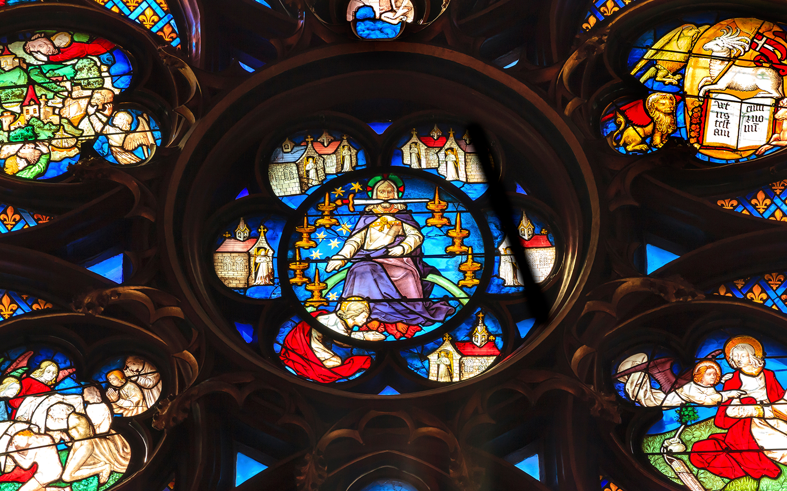 Saint Chapelle rose window with vivid blue and red iconography.