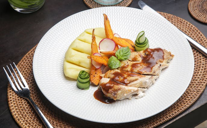 Pork with grilled vegetables and mashed potatoes on Berlin dinner cruise plate.