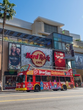 StarLine sightseeing bus in front of Hard Rock Cafe, Hollywood Boulevard, Los Angeles.