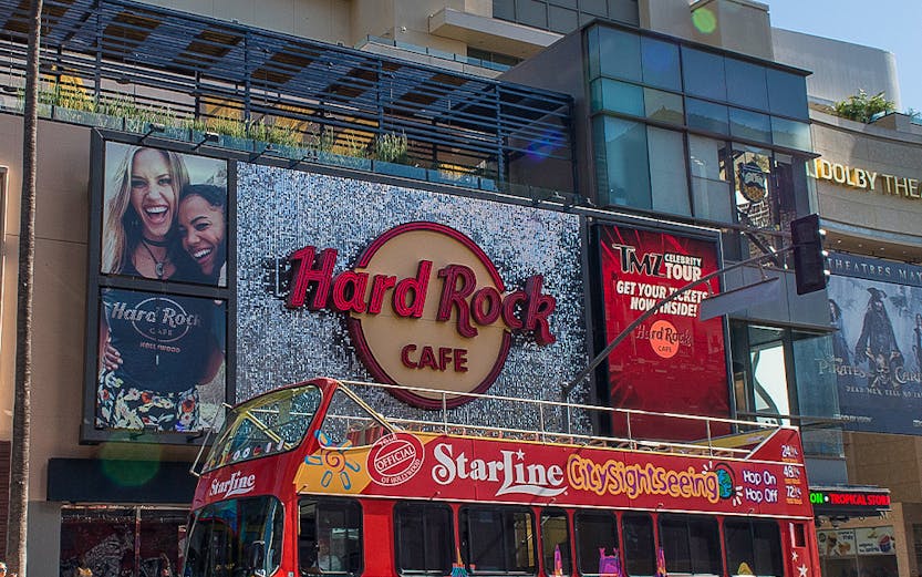 StarLine sightseeing bus in front of Hard Rock Cafe, Hollywood Boulevard, Los Angeles.