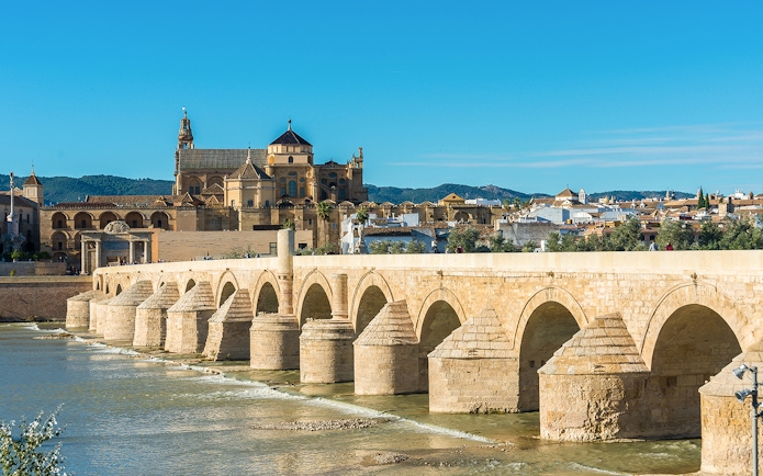 Roman Bridge and Mosque-Cathedral in Cordoba, Spain, viewed from the Guadalquivir River.