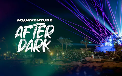 Aquaventure After Dark 2026 event with laser lights and palm trees at night.