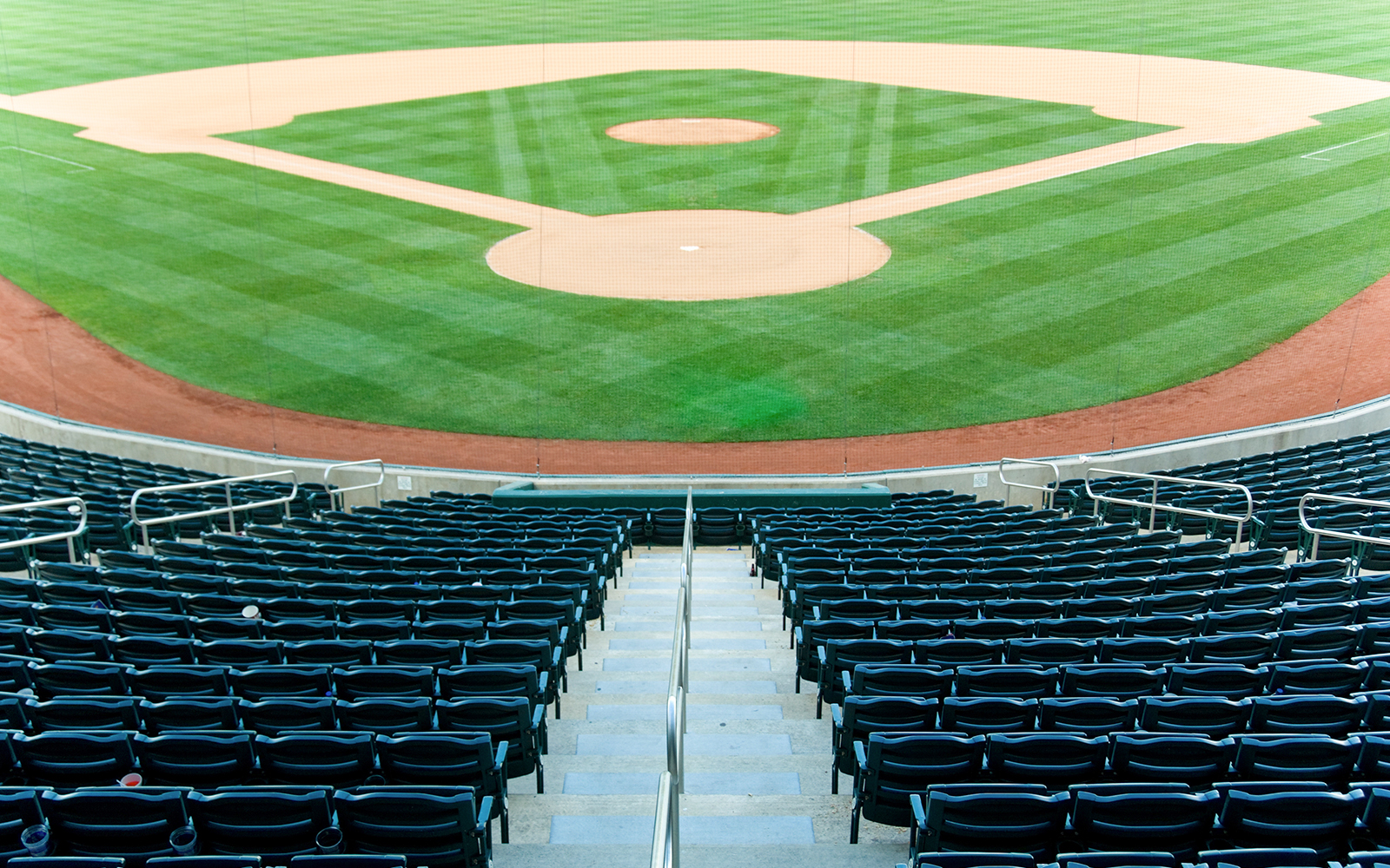 Stadium seating overlooking Fenway Park baseball field.