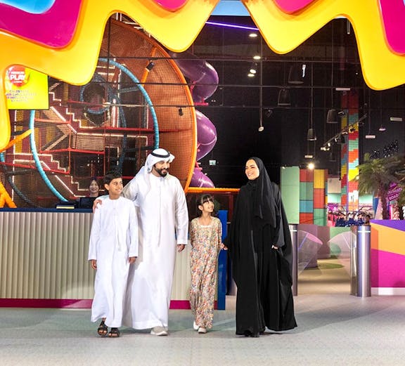 Children engaging in interactive play at Mission: Play! by Mattel, featuring colorful activity stations.