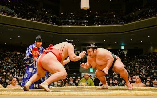 Wrestlers face off at the Grand Sumo Tournament in Japan.