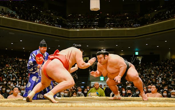 Wrestlers face off at the Grand Sumo Tournament in Japan.