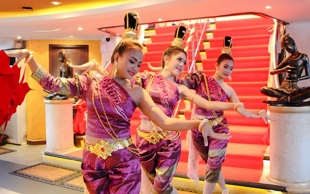 Traditional dancers performing on Chao Phraya Valentine's Day dinner cruise at Asiatique Riverfront.