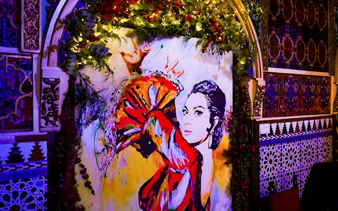 Colorful flamenco dancer mural inside Torres Bermejas, Madrid.