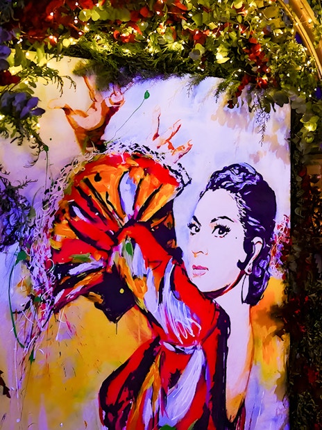 Colorful flamenco dancer mural inside Torres Bermejas, Madrid.