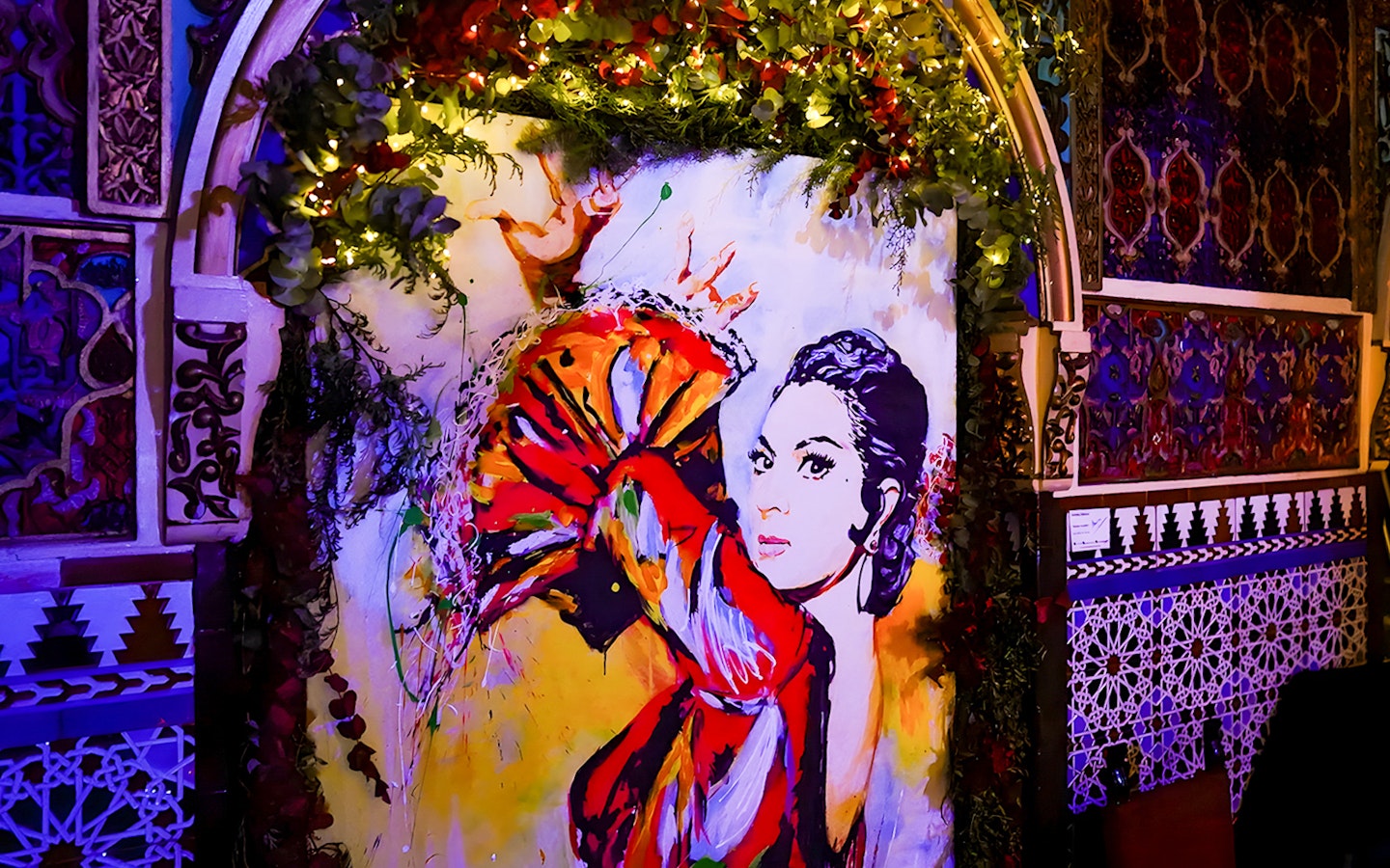 Colorful flamenco dancer mural inside Torres Bermejas, Madrid.