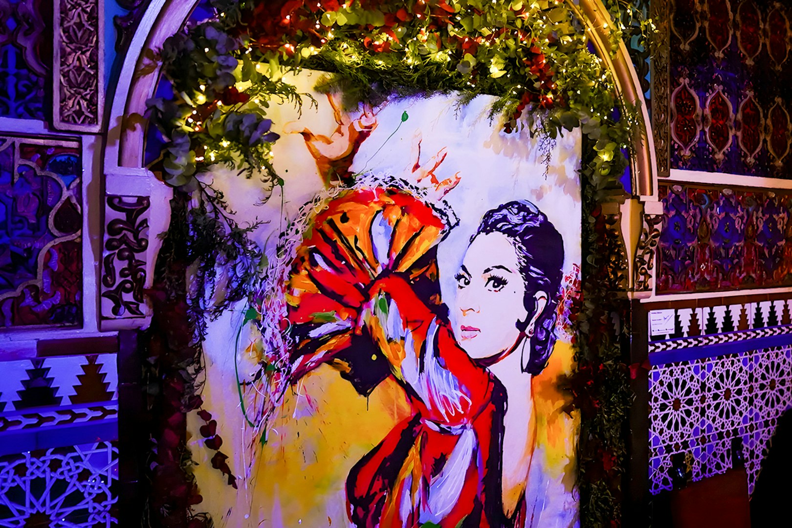 Colorful flamenco dancer mural inside Torres Bermejas, Madrid.