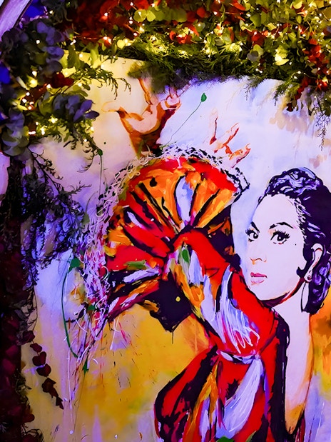 Colorful flamenco dancer mural inside Torres Bermejas, Madrid.