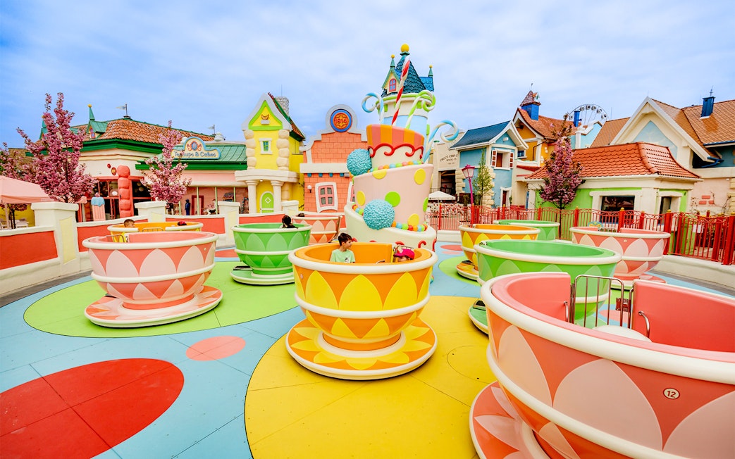 Kids enjoying teacup ride at Energylandia Theme Park, Zator, near Krakow, Poland.