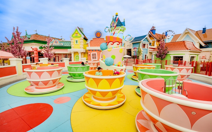 Kids enjoying teacup ride at Energylandia Theme Park, Zator, near Krakow, Poland.