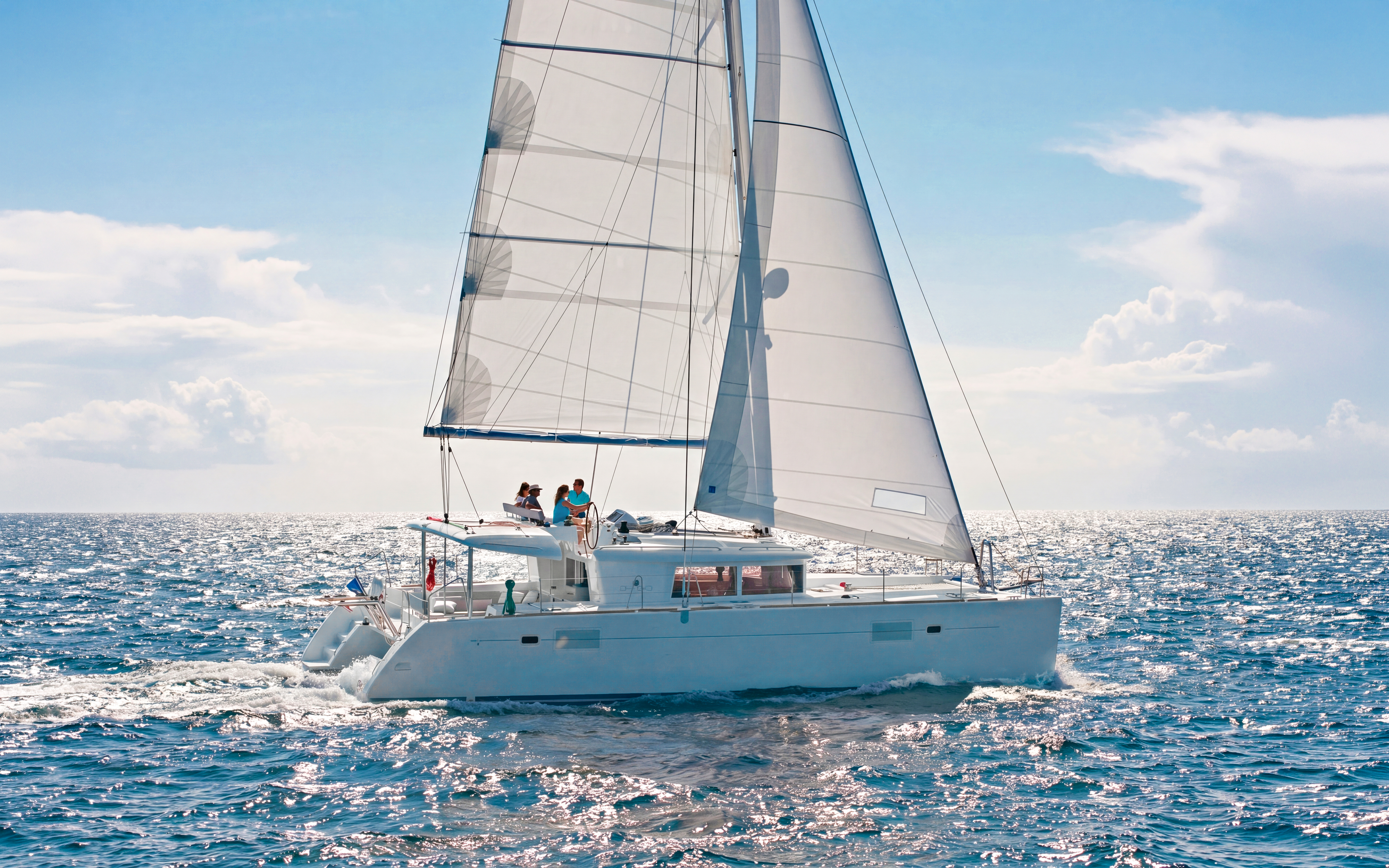 Catamaran sailing in Heraklion with passengers enjoying an onboard chef experience.