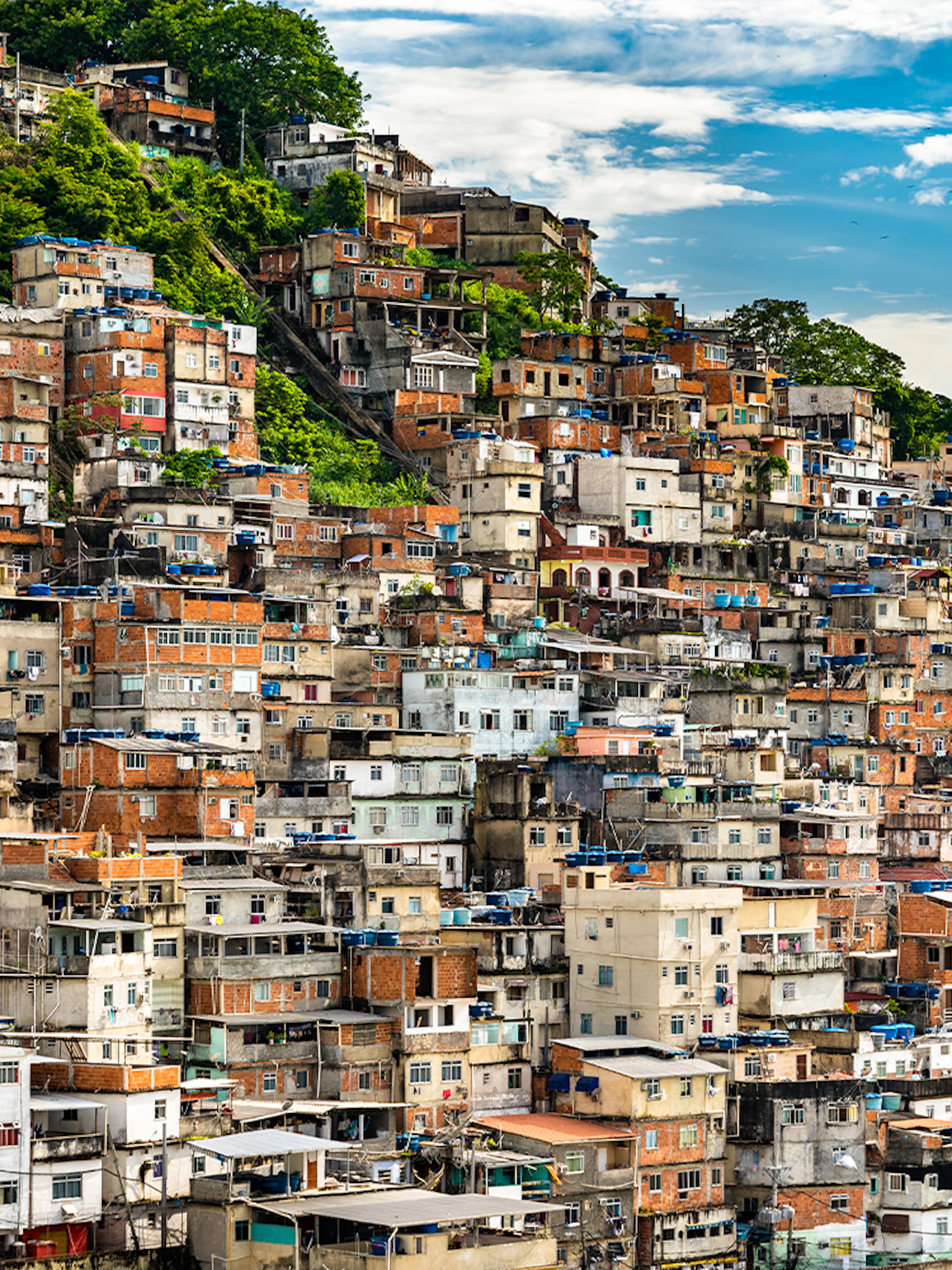 Favela Cantagalo hillside view in Rio de Janeiro, Brazil, with colorful stacked houses.