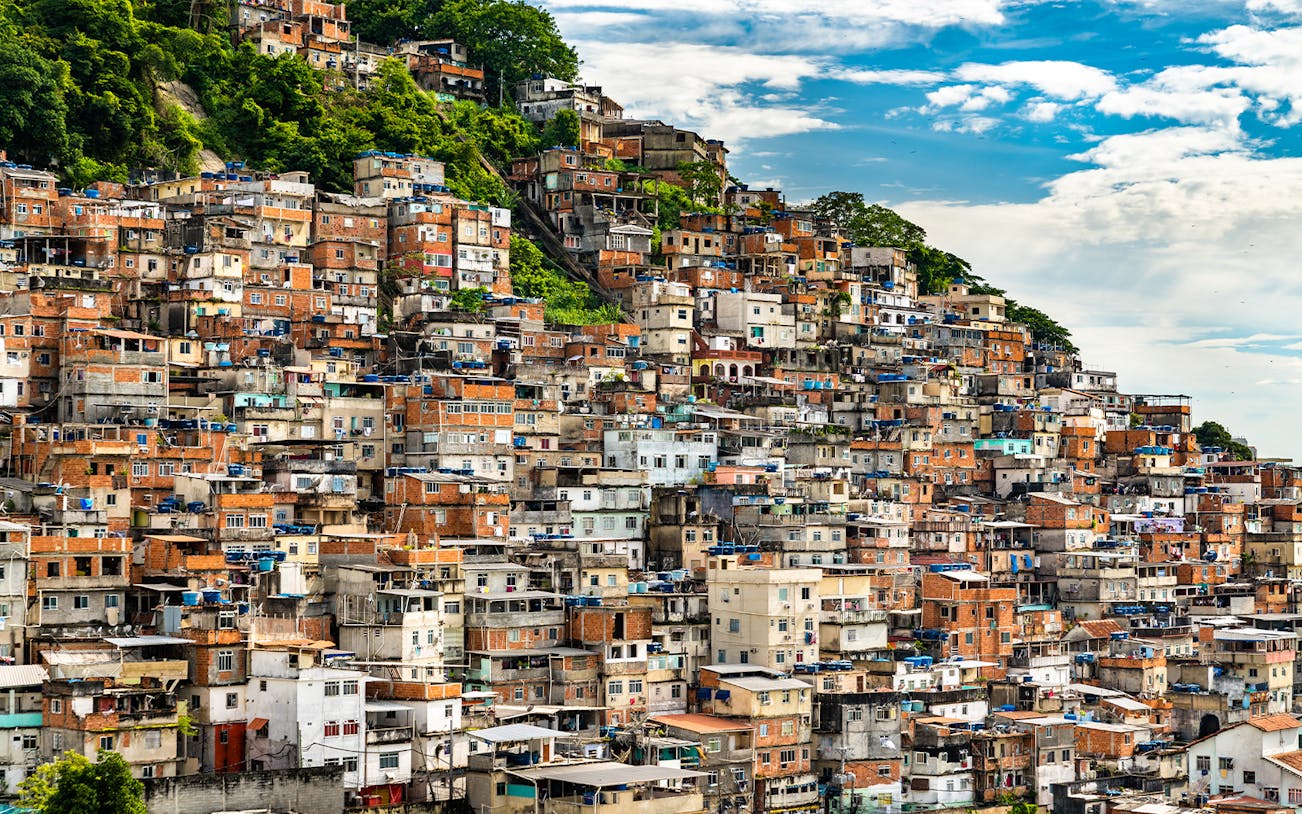Favela Cantagalo hillside view in Rio de Janeiro, Brazil, with colorful stacked houses.
