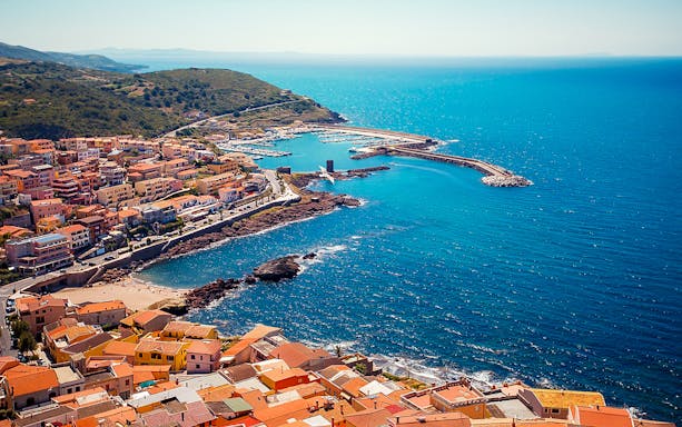 Aerial view of Castelsardo coastline and harbor in Sardinia, Italy.