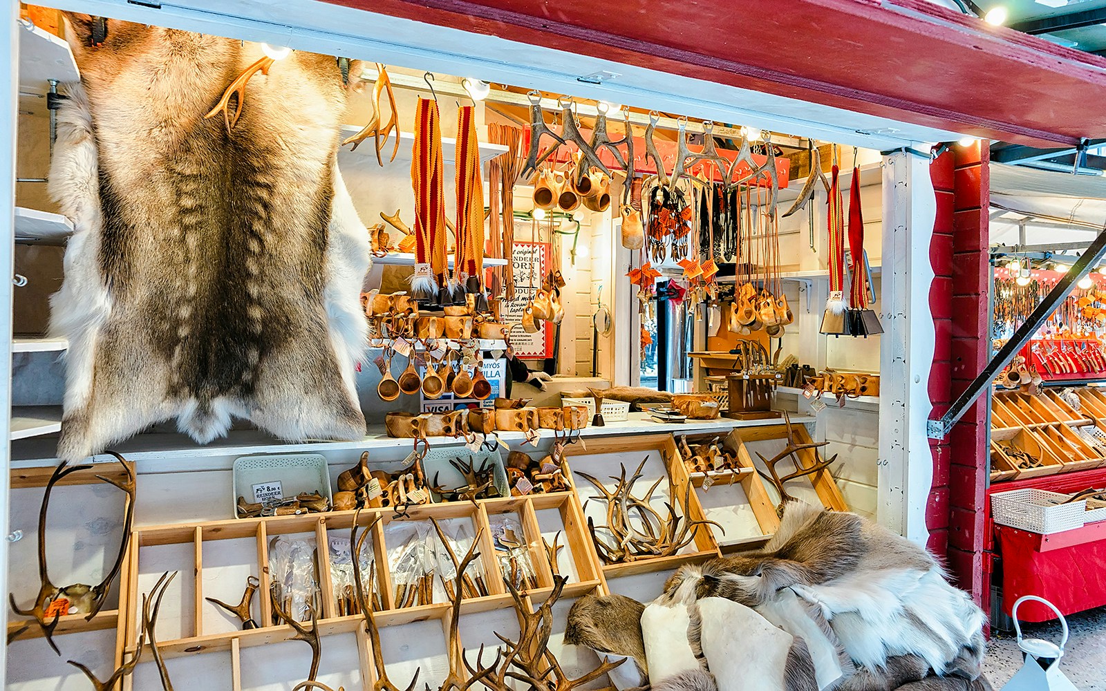 Reindeer fur and antlers displayed at a Finnish market stall.