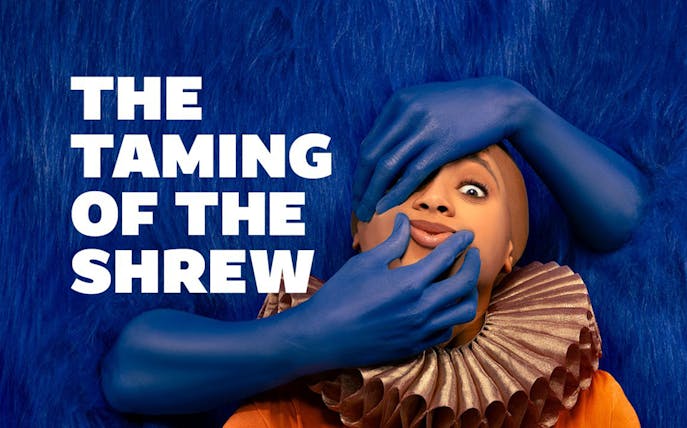 The Taming of the Shrew poster with blue-gloved hands on a person's face.