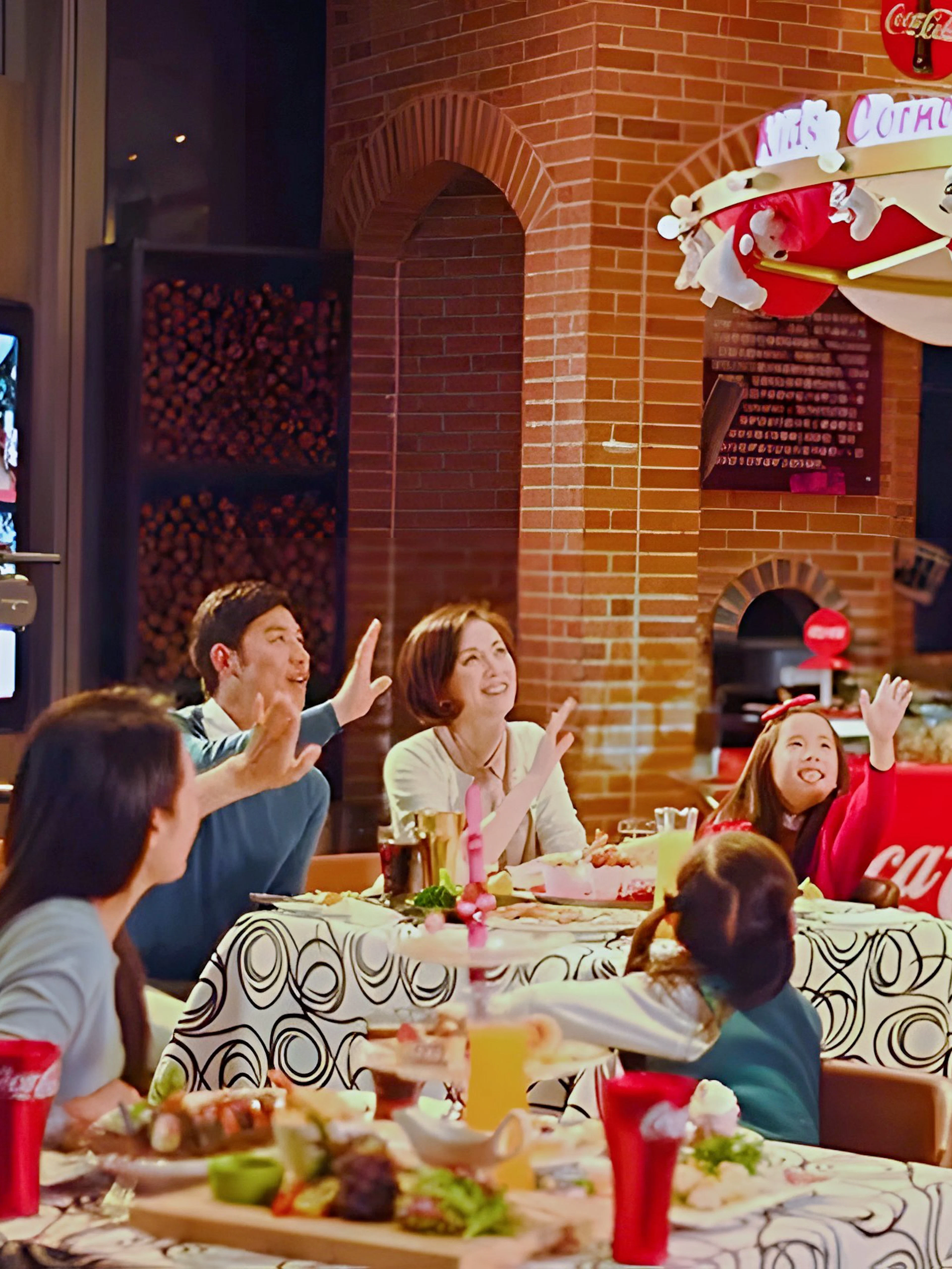 Family dining at Coca-Cola Happy Restaurant Buffet, Oriental Pearl Tower, Shanghai.