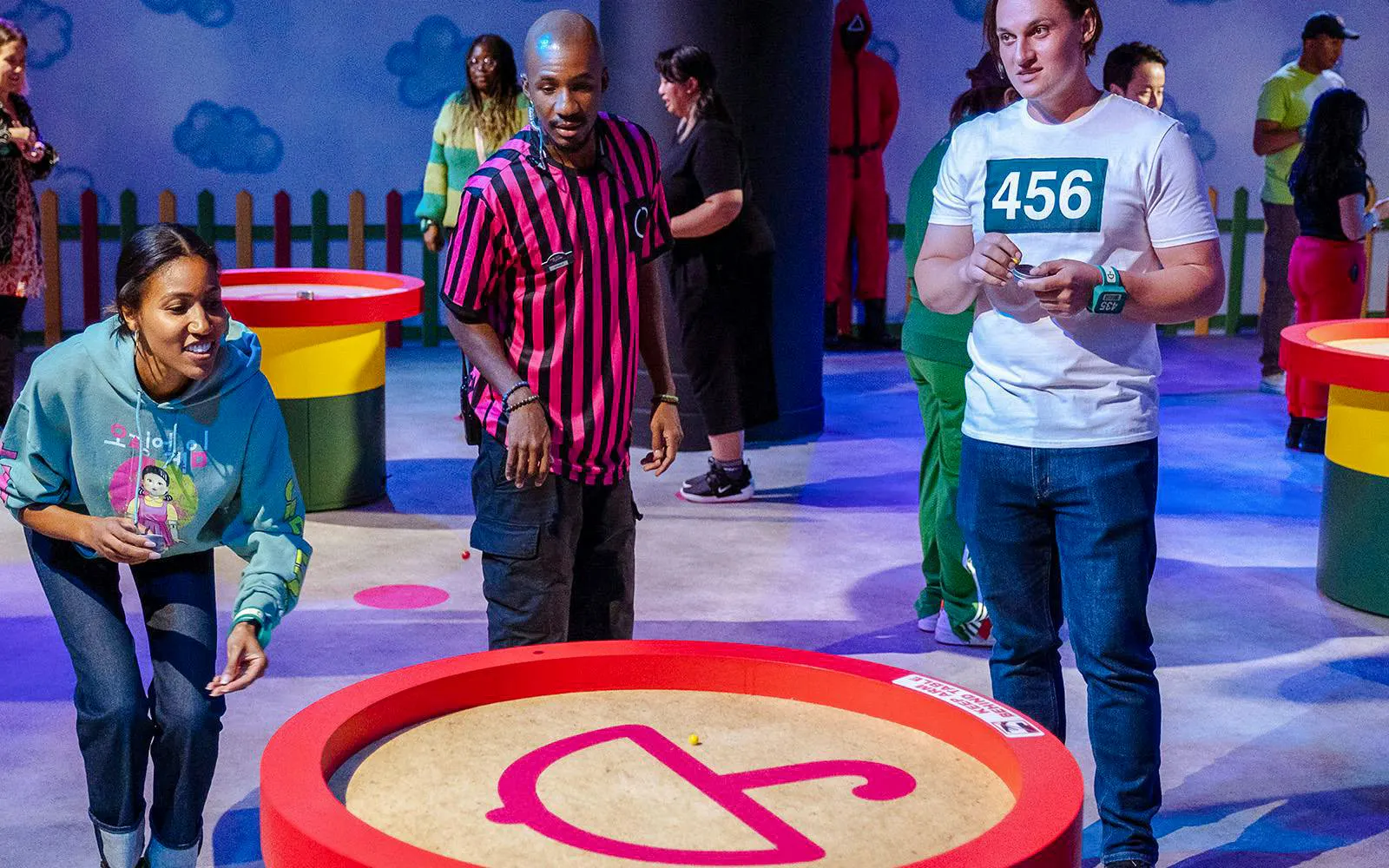 Guests participating in Squid Game activities at Netflix House Philadelphia.