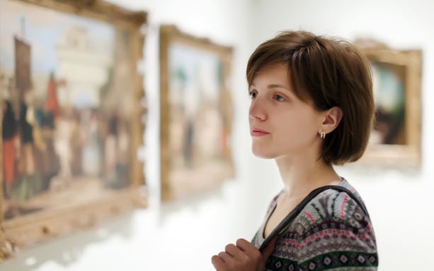 Guest viewing artwork inside Onufri National Iconographic Museum, Berat.