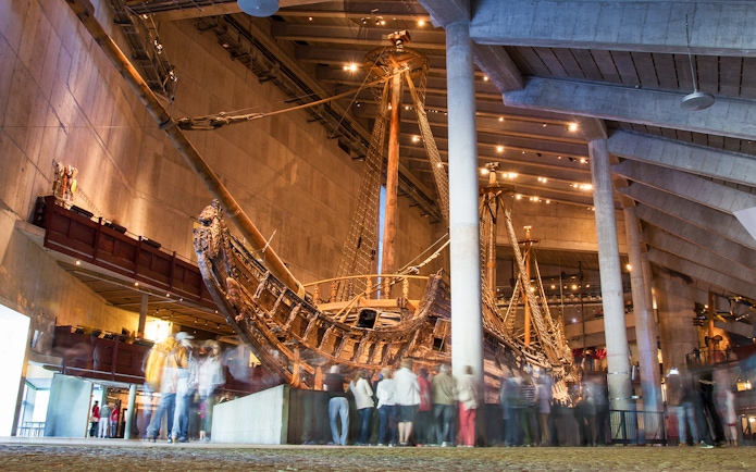 Vasa Museum ship exhibit with visitors in Stockholm.