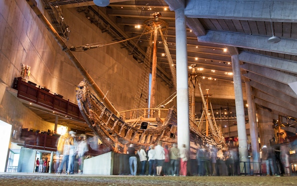 Vasa Museum ship exhibit with visitors in Stockholm.